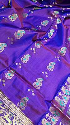 Rani pink and purple dual tone colour with golden colour zari Figure motif Swarnachari saree Rani pink and purple dual tone colour with golden colour zari Figure motif Swarnachari saree