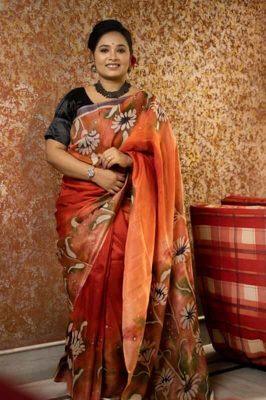 Rust Orange color pure Mulberry silk with flower hand batik motif saree from our Mystic Radainave collection Rust Orange color pure Mulberry silk with flower hand batik motif saree from our Mystic Radainave collection