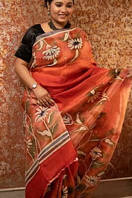 Rust Orange color pure Mulberry silk with flower hand batik motif saree from our Mystic Radainave collection Rust Orange color pure Mulberry silk with flower hand batik motif saree from our Mystic Radainave collection