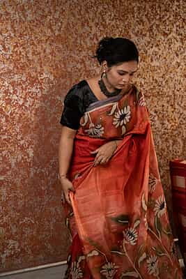 Rust Orange color pure Mulberry silk with flower hand batik motif saree from our Mystic Radainave collection Rust Orange color pure Mulberry silk with flower hand batik motif saree from our Mystic Radainave collection