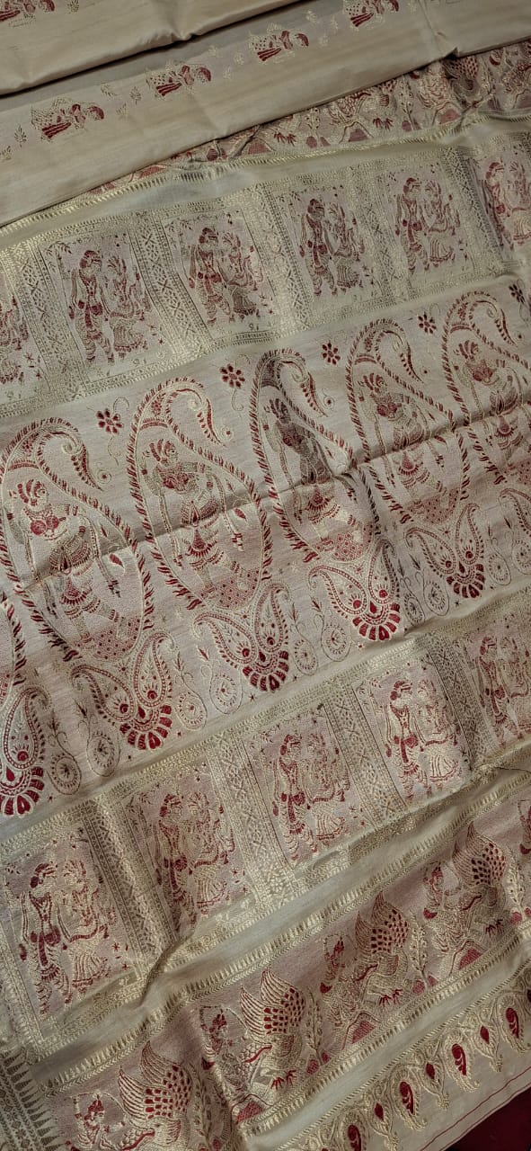 Figure motif Swarnachari in pure tassar with golden zari and red meena Figure motif Swarnachari in pure tassar with golden zari and red meena