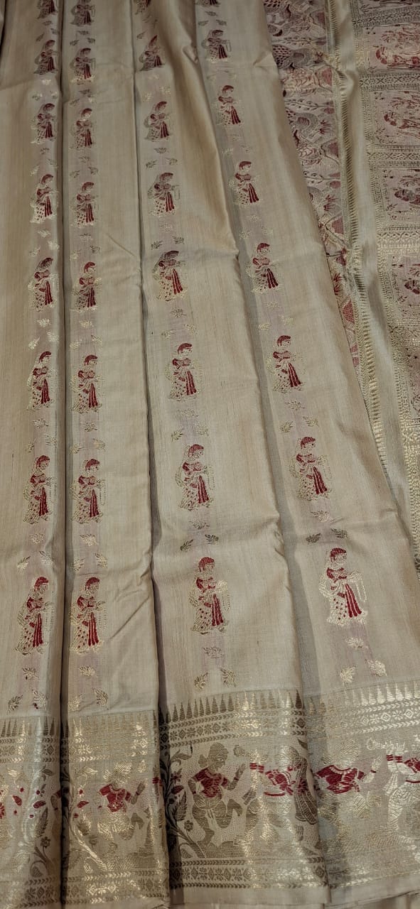 Figure motif Swarnachari in pure tassar with golden zari and red meena Figure motif Swarnachari in pure tassar with golden zari and red meena