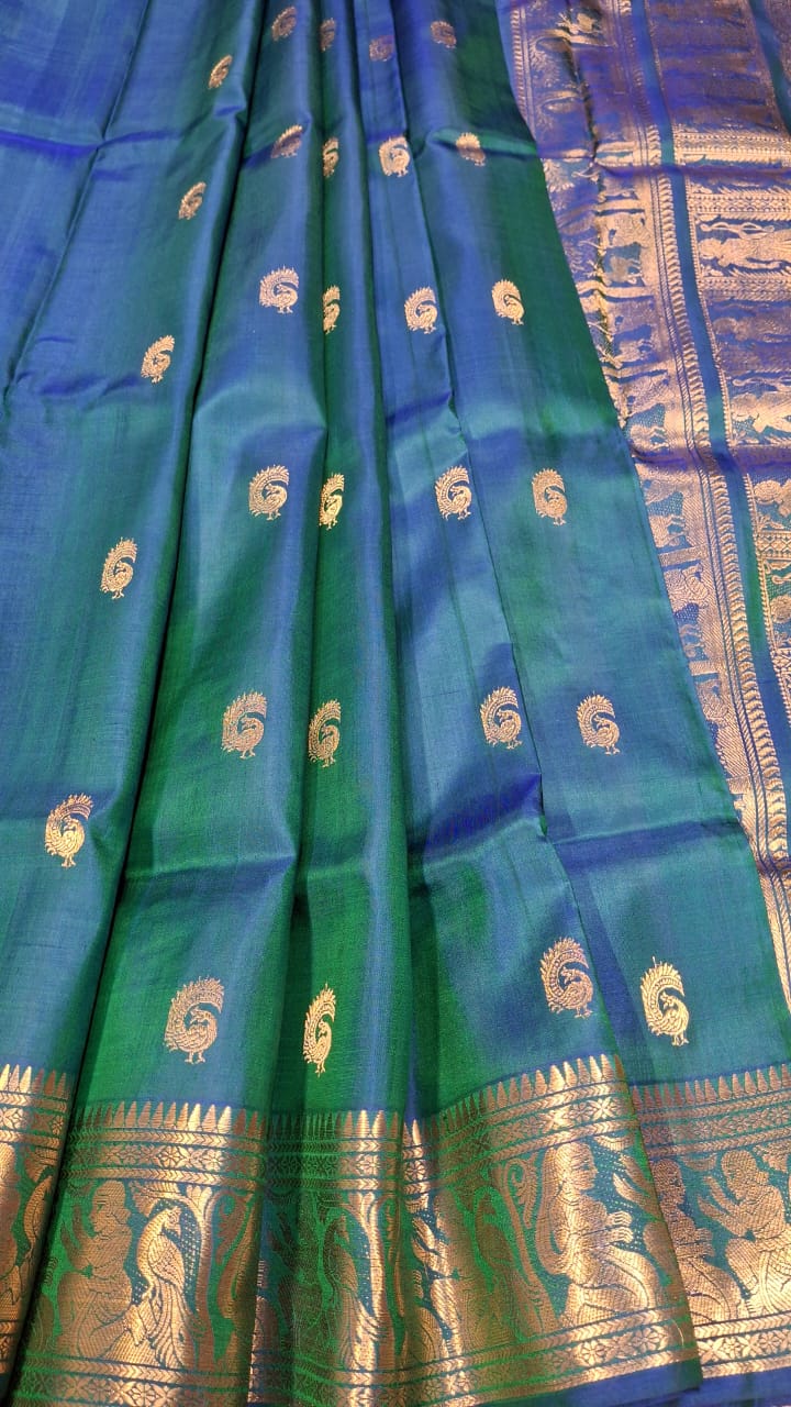 Peacock Motif Swarnachari blue and green dual tone saree with golden zari Peacock Motif Swarnachari blue and green dual tone saree with golden zari