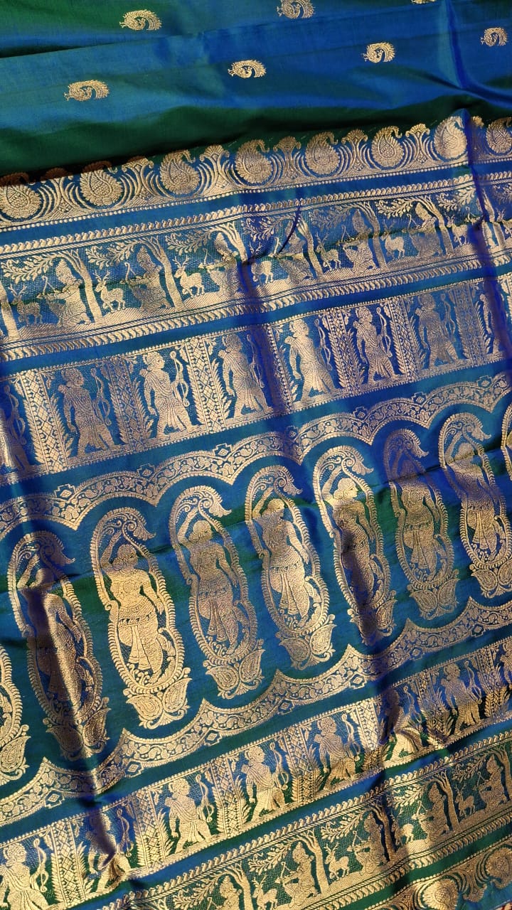 Peacock Motif Swarnachari blue and green dual tone saree with golden zari Peacock Motif Swarnachari blue and green dual tone saree with golden zari
