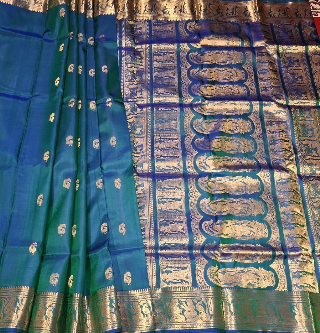 Peacock Motif Swarnachari blue and green dual tone saree with golden zari