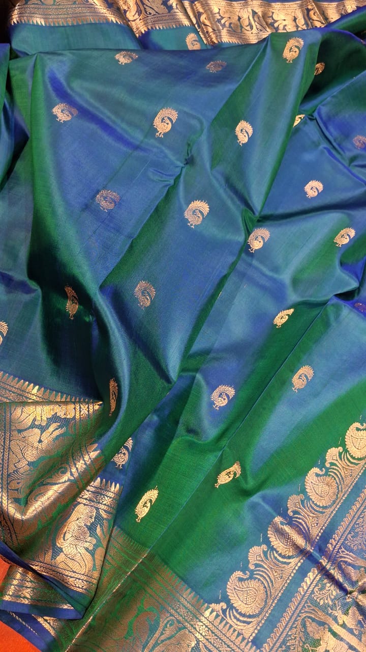Peacock Motif Swarnachari blue and green dual tone saree with golden zari Peacock Motif Swarnachari blue and green dual tone saree with golden zari