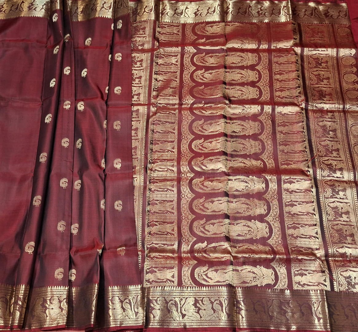 Red and chocolate dual tone peacock motif Swarnachari  resham saree with golden zari.