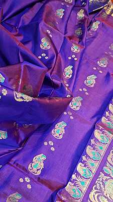 Rani pink and purple dual tone colour with golden colour zari Figure motif Swarnachari saree Rani pink and purple dual tone colour with golden colour zari Figure motif Swarnachari saree